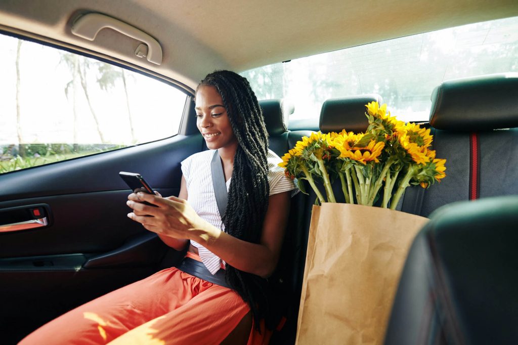 Woman riding in taxi.jpg